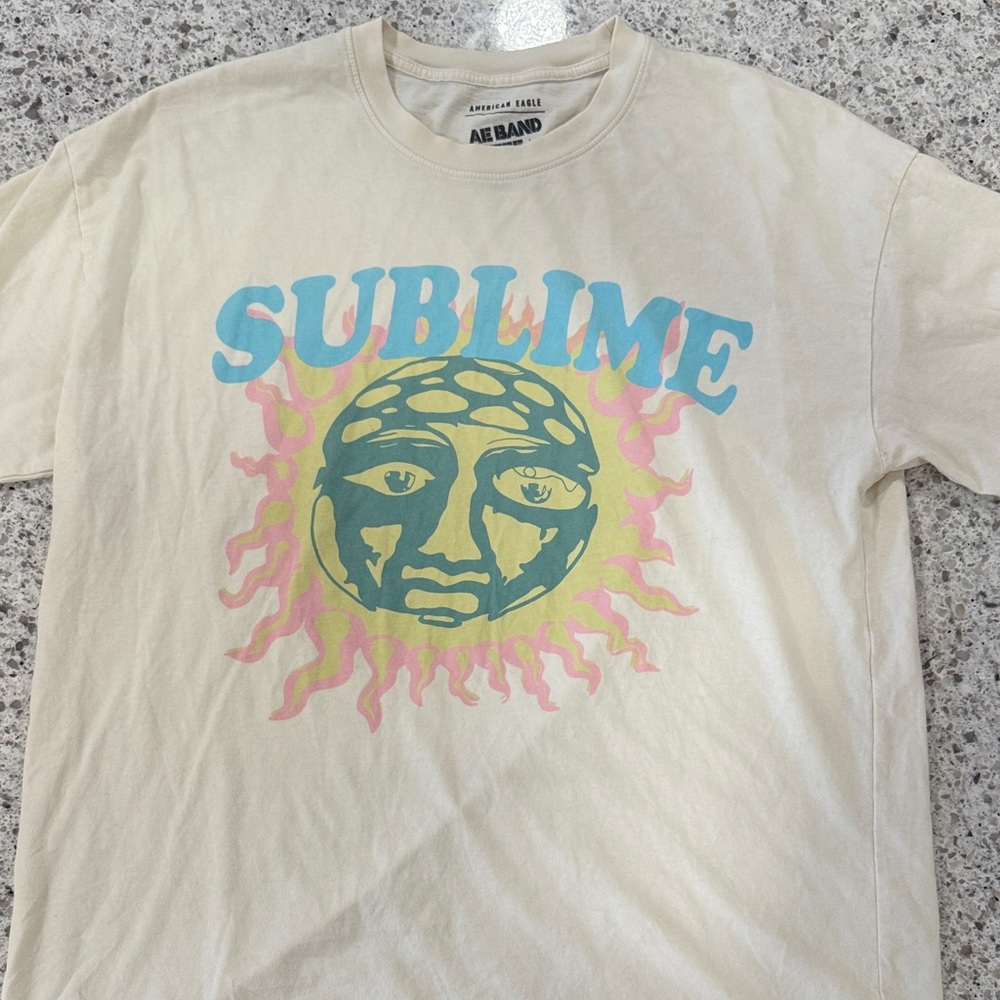 American Eagle Oversized Cream Tee with Sublime Graphic